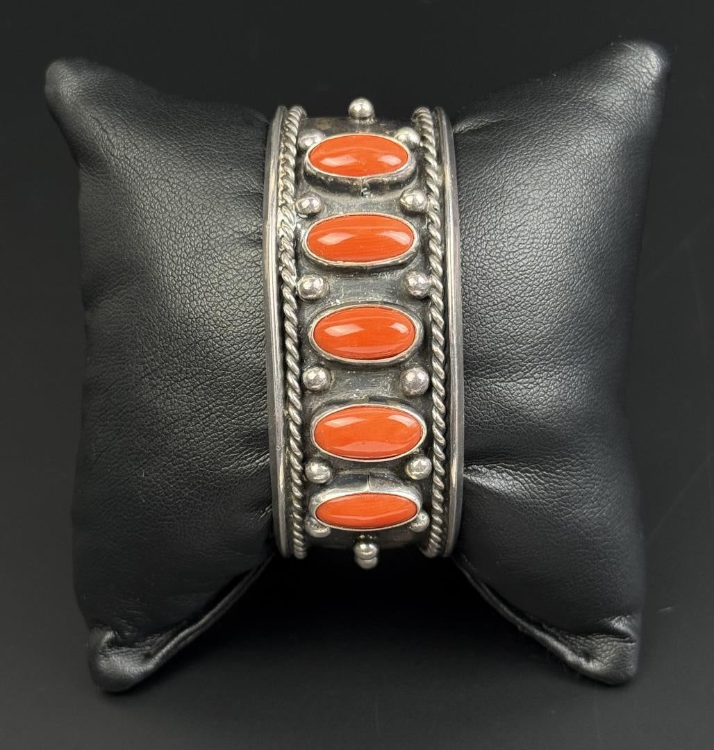 Navajo Sterling Silver Coral Bracelet: 39.7 grams. 5 1/4" inner circumference.