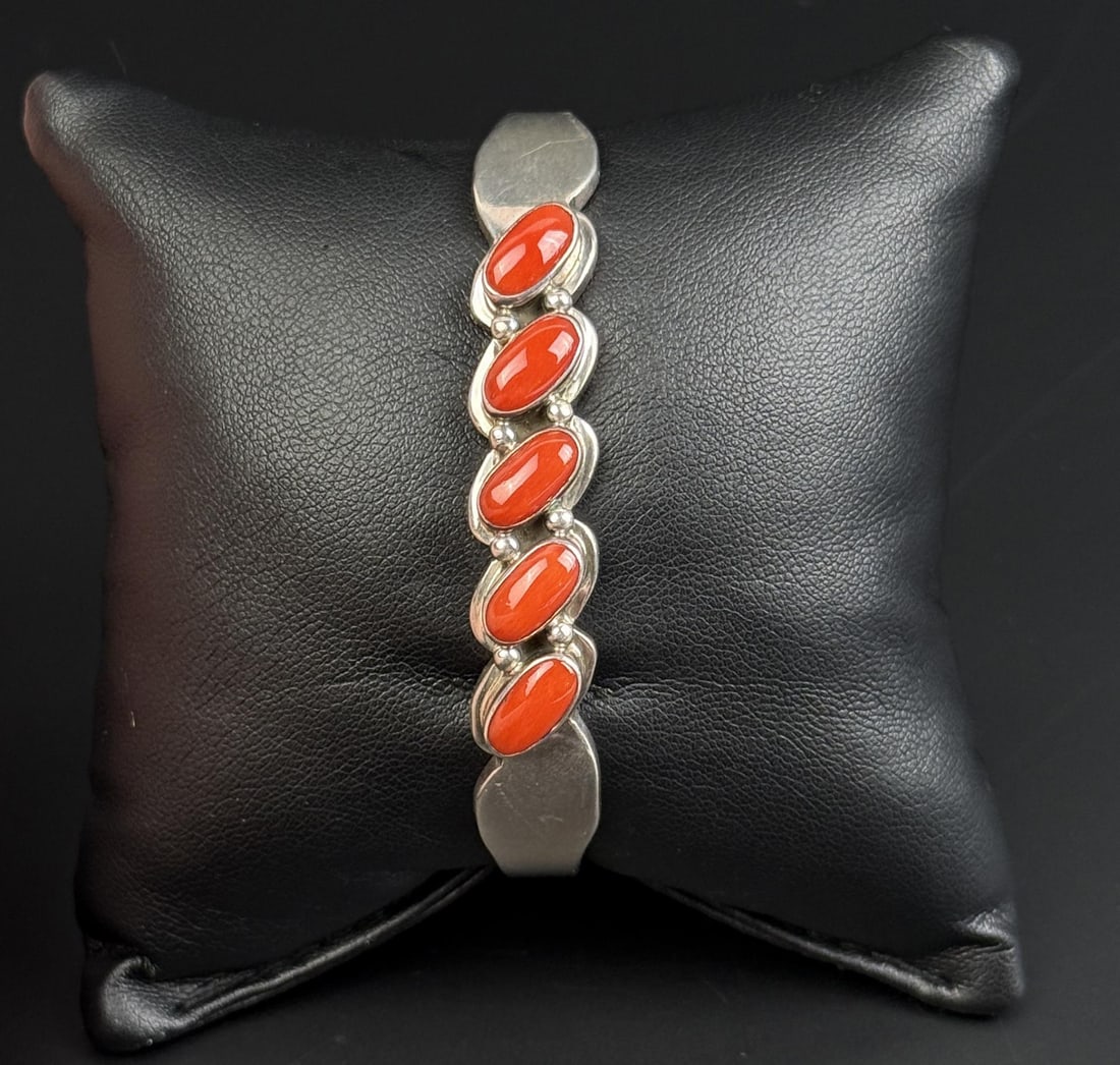 Navajo Sterling Silver Coral Bracelet: 39.1 grams. 5 1/2" inner circumference.