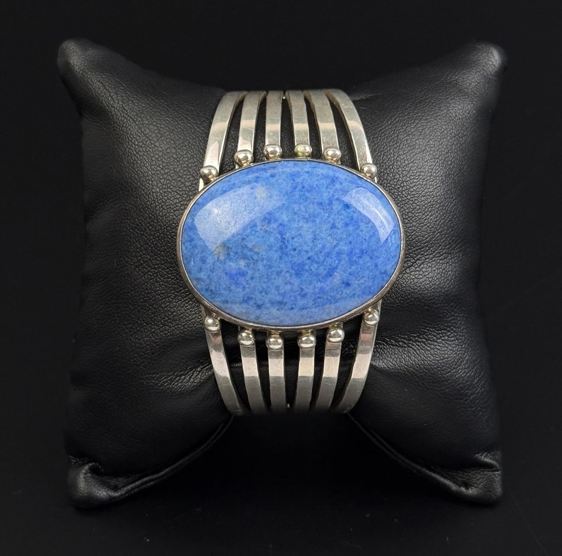 Navajo Sterling Silver Denim Lapis Lazuli Bracelet: Most likely the work of Navajo Silversmith Cecil Henry. 63.1 grams. 5 1/2" inner circumference.