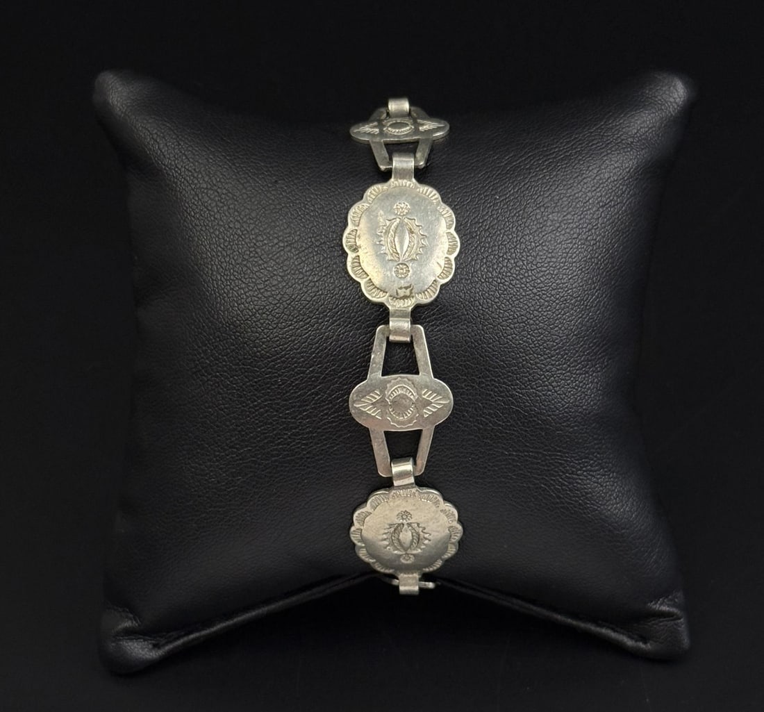 Navajo Sterling Silver Concho Bracelet: 7" inner circumference. 13.92 grams.