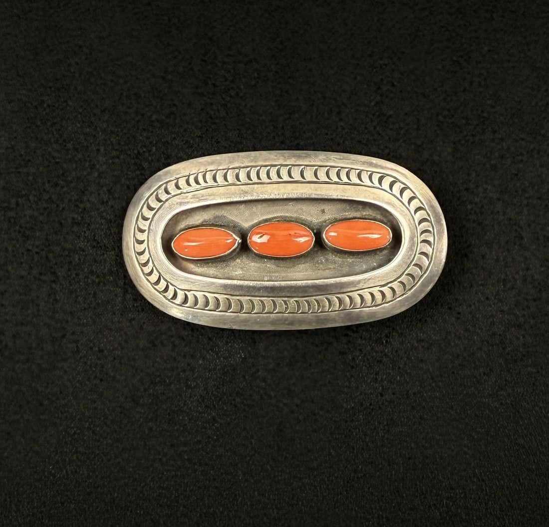 Navajo Sterling Silver Coral Belt Buckle: 32.68 grams. 1 1/2" by 2 3/4".