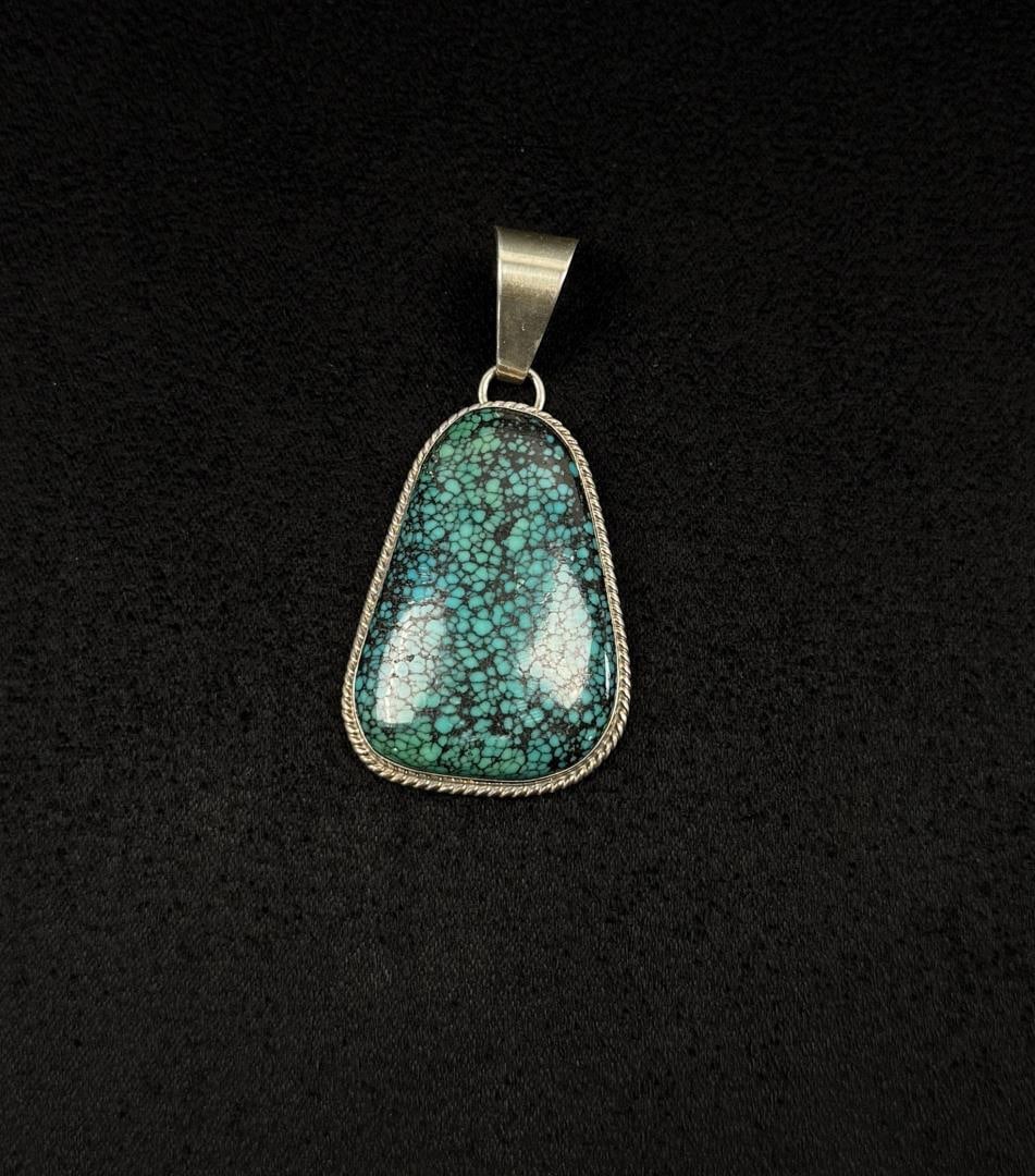 Milton Lee Navajo Sterling Turquoise Pendant: 13.4 grams. 2 1/4" by 1 1/8".