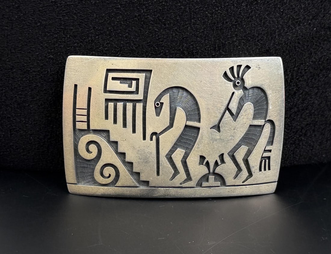 Lawrence Saufkie Hopi Sterling Silver Belt Buckle: 2" by 3". 57.34 grams.