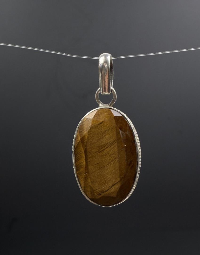 Sterling Silver Tigers Eye Pendant: 9.03 grams. 1 5/8" by 5/8".
