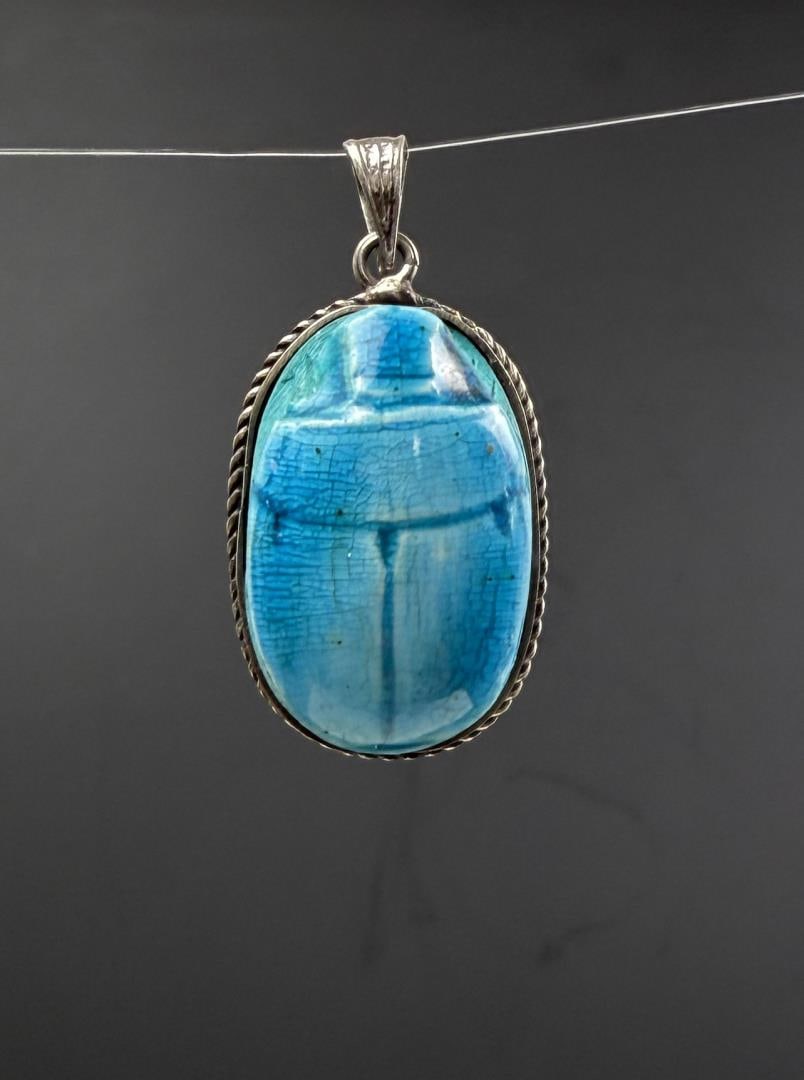 Ancient Faience Pottery Egyptian Scarab Pendant: 12.58 grams. 1 1/2" by 3/4". Set in Sterling Silver.