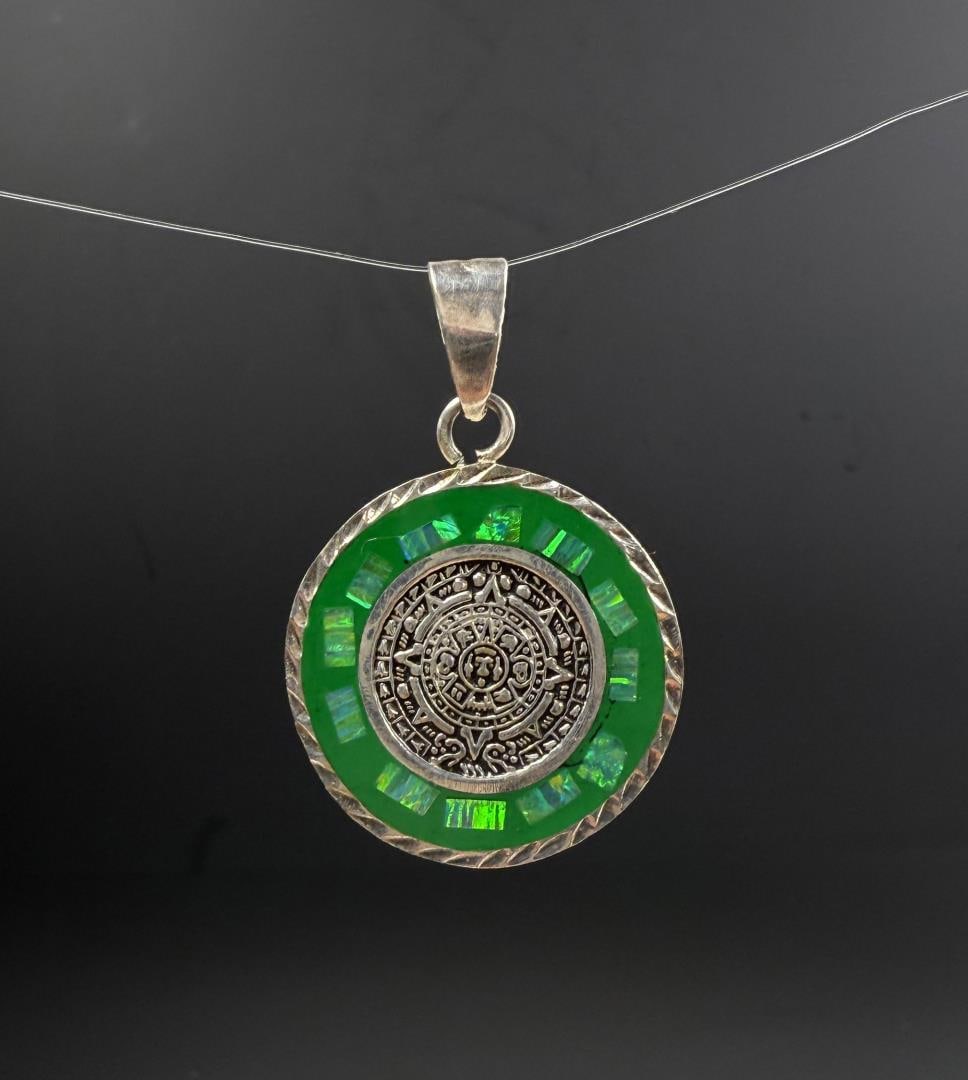 Taxco Mexico Sterling Opal Aztec Calendar Pendant: 9.01 grams. 1 1/4" by 1 3/4".