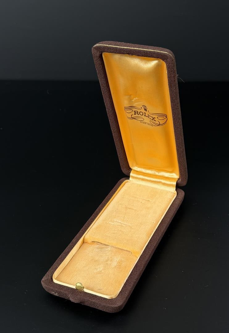 1940s Rolex Push Button Watch Box: 6 3/8" by 2 5/8" by 1 1/8".