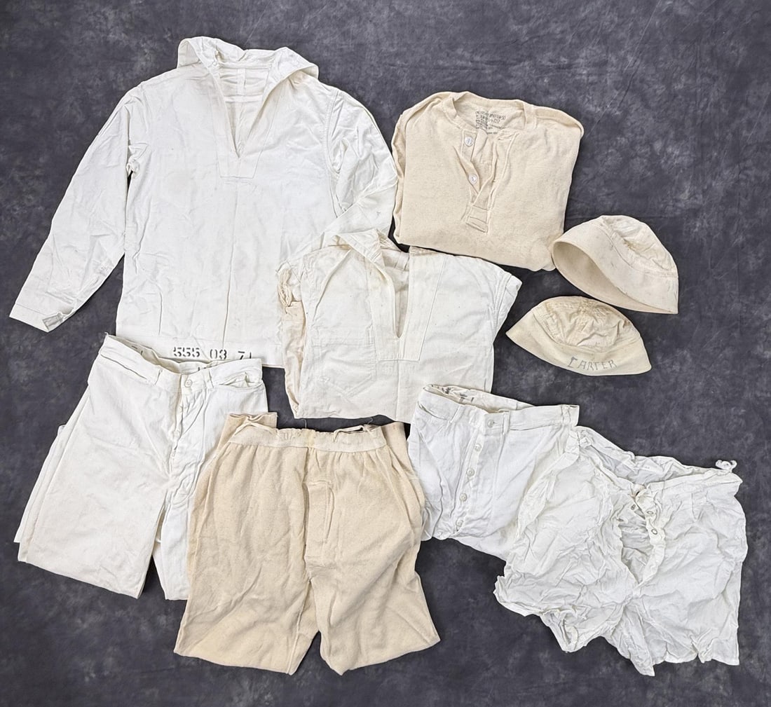 WW2 US Navy White Uniform Grouping: Deck Uniforms, Pants, Underwear, and hats. Named to Wayne J. Hiett.