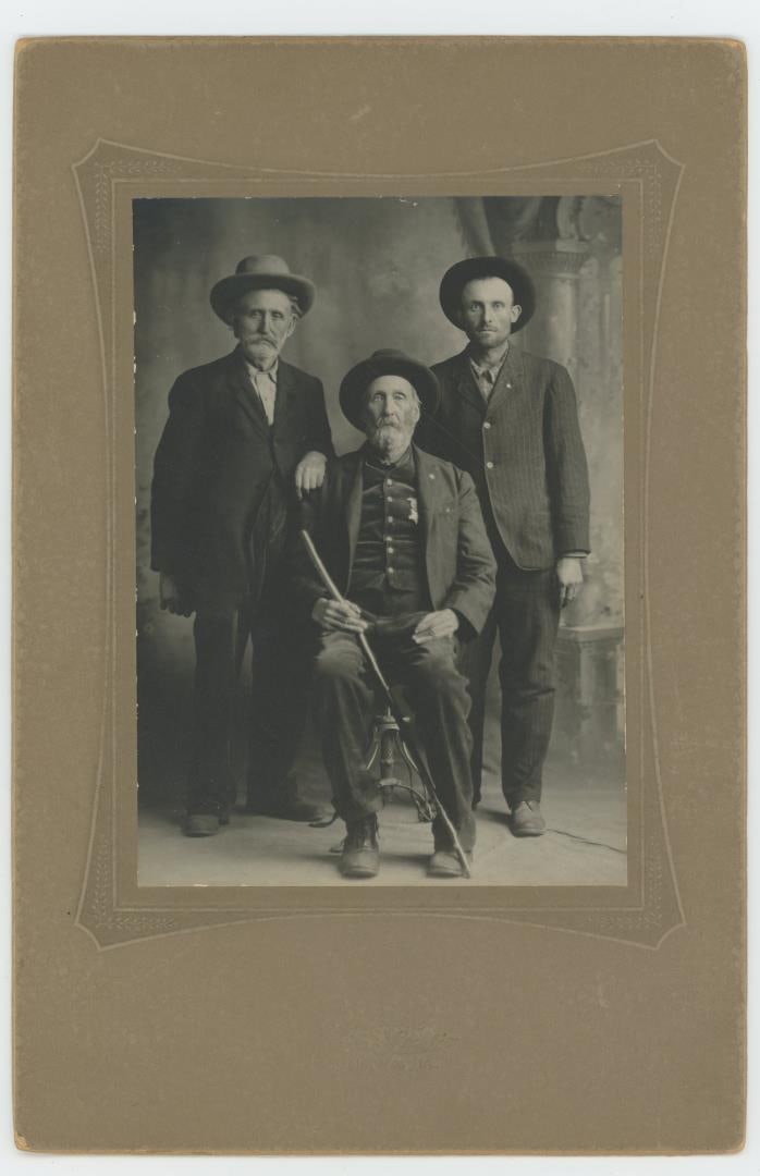 Custer Battle Massacre Scout Survivor Photo: Photo is 6" by 9". Back of card reads: The old fellow standing is Tom Turman, the one sitting is Wes Turman, brothers, pioneers of Western Song. Wes was a scout for Custer being saved by being sent wi