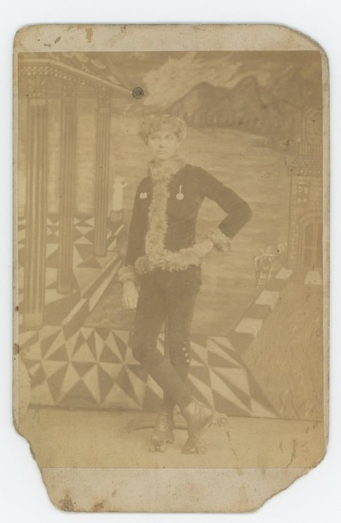 Fancy Roller Skater with Medals Cabinet Photo (1 of 3)