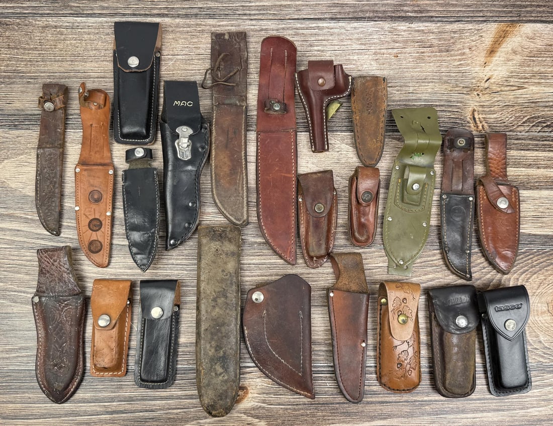 Collection of 23 Leather Knife Sheaths: Brands include MAC, Marlboro Country Store, and Tasco. Largest is 12 1/4" long.