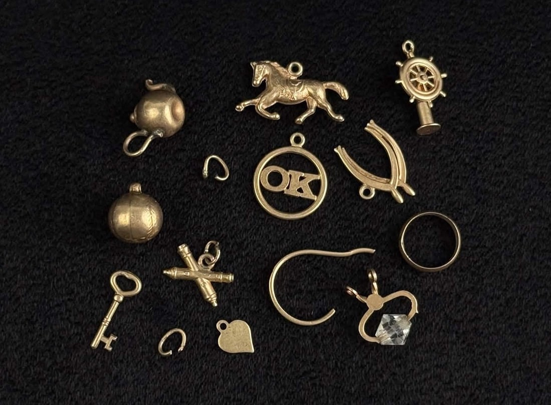 Collection of 10k Gold Charms: 8.3 grams. Lot requires payment via non credit card only.