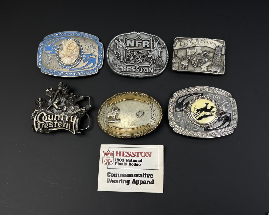 Collection of Western Cowboy Rodeo Belt Buckles: Nice grouping. The central buckle is the 1983 Hesston National Finals Rodeo (NFR) 25th Anniversary Series buckle.
