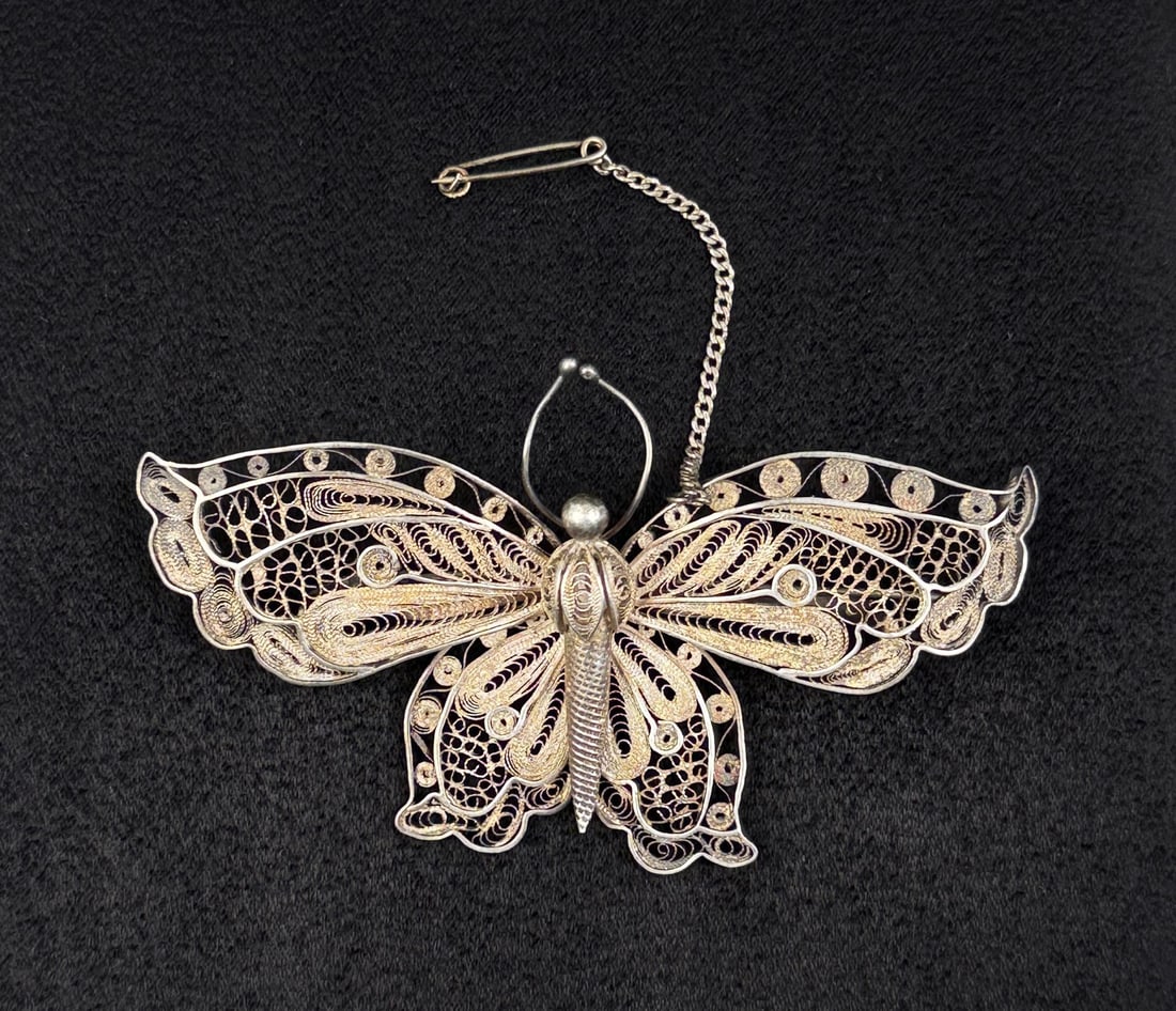 Sterling Silver Filigree Butterfly Brooch: 3 7/8" by 2 1/4". 20.61 grams.