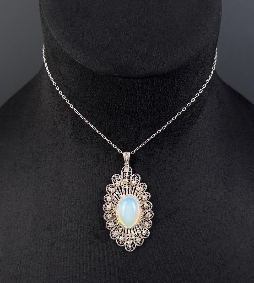 Sterling Silver Moonstone Filigree Necklace: 11 7/8" long as displayed. 10.29 grams.