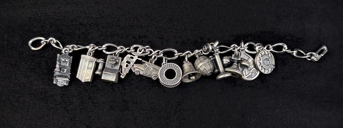 Attendance Sterling Bell Telephone Charm Bracelet: 7" internal circumference. 54.17 grams.