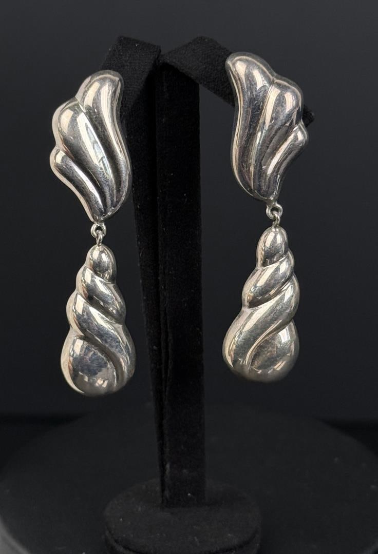 Sterling Silver Earrings: 2 1/4" long. 7.74 grams total.