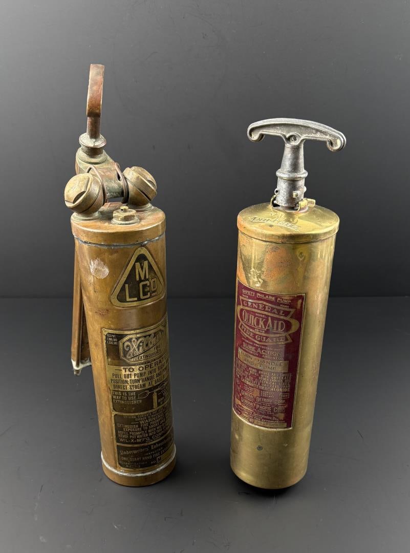 Pair of Antique Hand Pump Brass Fire Extinguishers: The extinguisher on the left was manufactured by Mergenthaler Linotype Company (MLCo) and is known as the "Wilbur". It is being sold alongside a General Quick Aid Model 85 Heavy Duty Pump Handle Fire 
