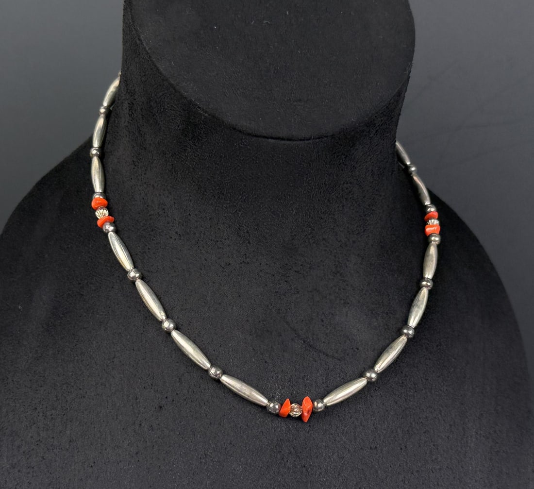Navajo Sterling Silver Coral Bench Bead Necklace: 8 1/2" long as displayed. 23.65 grams.