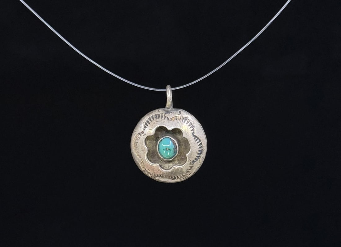 Signed Navajo Sterling Silver Turquoise Pendant: Measures 4/5" in diameter. 3.07 grams. Signed.