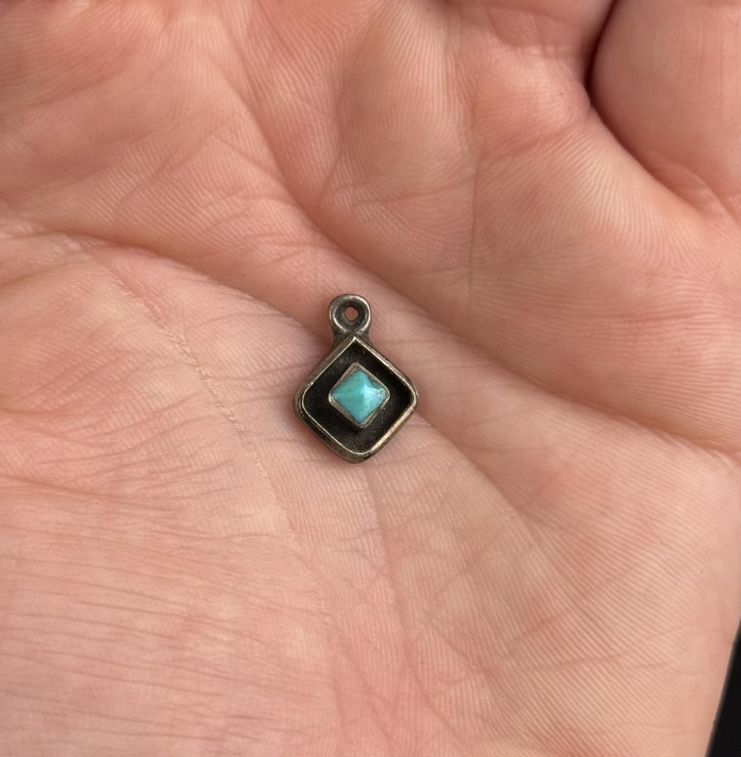 Navajo Sterling Silver Turquoise Pendant: 1/2" long. .94 grams.