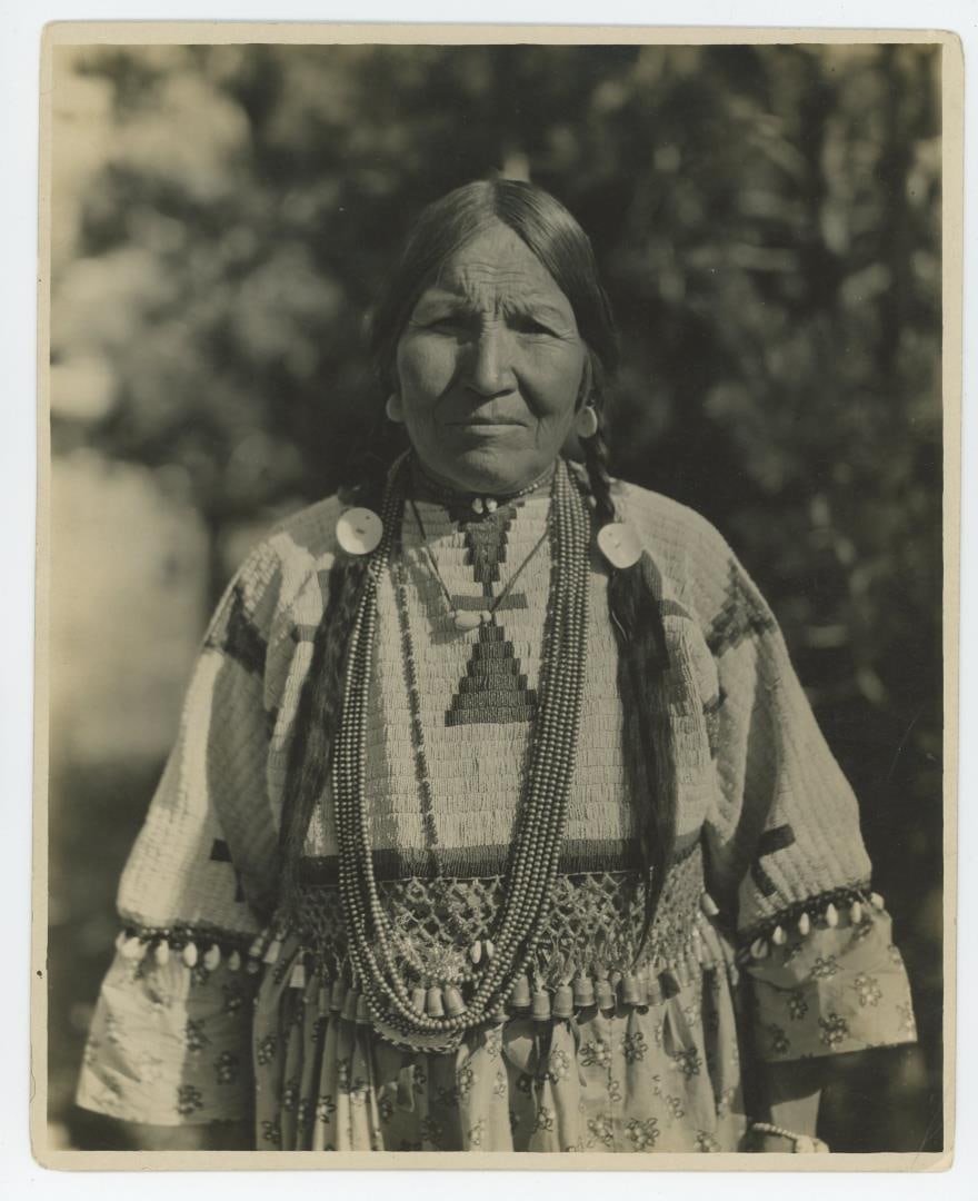 Long Time Pipe Woman Blackfoot Indian Photo: Signed by Helen Fitzgerald on the back. Taken in Glacier National Park Montana, she was illustrated by Winold Reiss. 8" by 10".