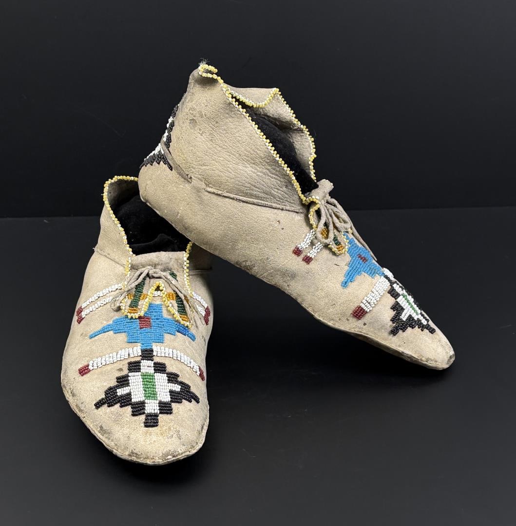 Mescalero Apache Native American Indian Moccasins: 11 1/8" by 4 3/4" by 4 1/8". Scarce set of beaded moccasins. Last Quarter of the 19th Century.