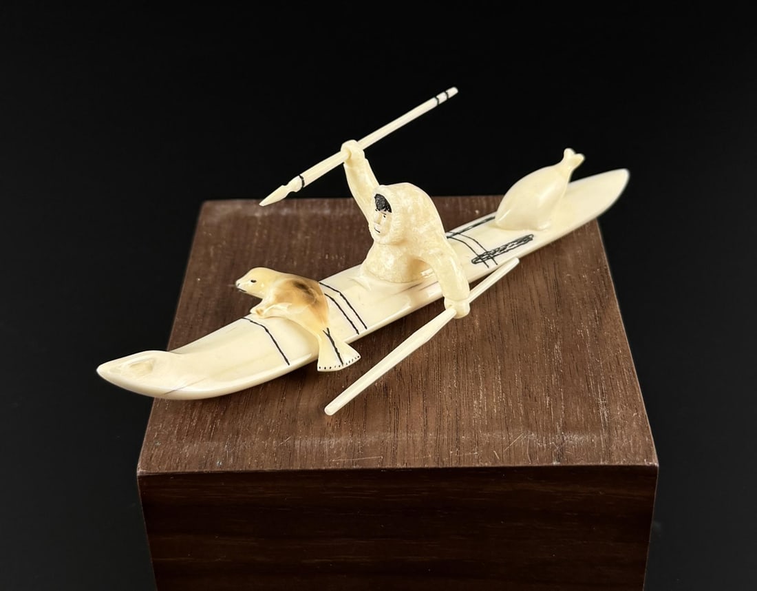 Joe Kunnuk Inupiaq Inuit Eskimo Ivory Seal Hunter: 4 7/8" by 3 1/2" by 1 1/4". Native made prior to 1972. This item cannot be shipped to Oregon, California, Hawaii, New York, New Jersey, Internationally, or any other state that prohibits.
