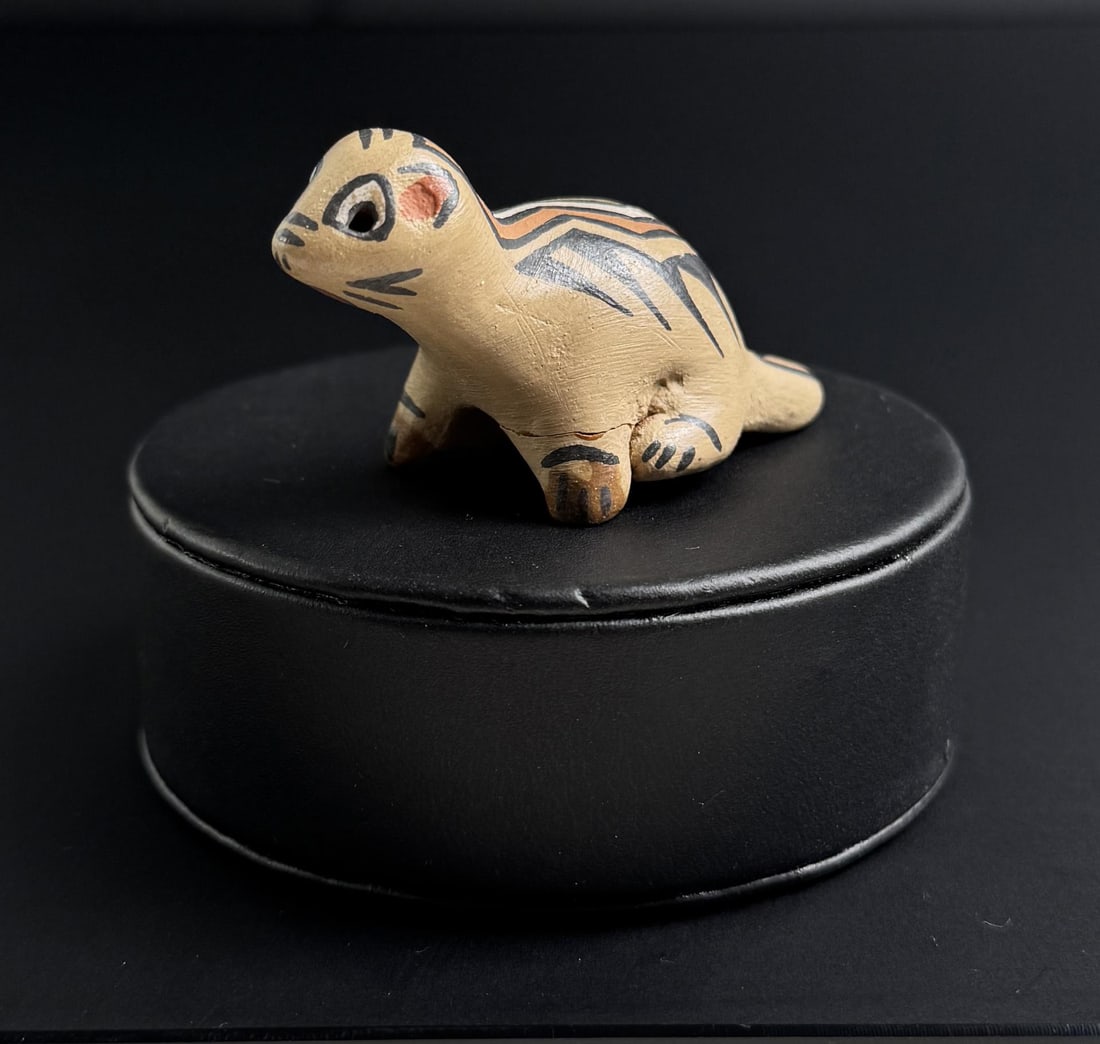 Margaret and Luther Gutierrez Pottery Skunk: 2 1/2" by 1 1/4" by 1". One repaired leg. Santa Clara Pueblo.
