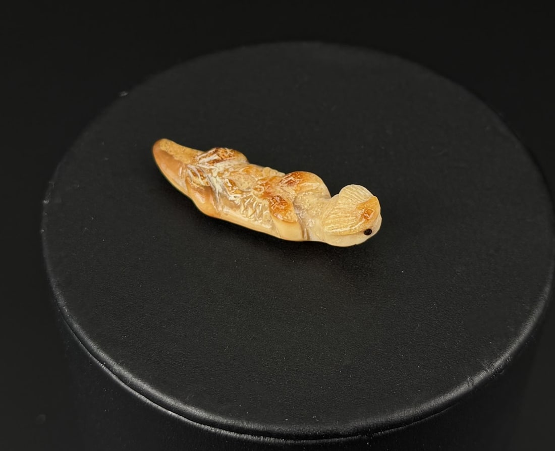 Alaskan Inuit Eskimo Carved Ivory Otter: 1 1/2" by 1/2" by 1/4". Native made prior to 1972. This item cannot be shipped to Oregon, California, Hawaii, New York, New Jersey, Internationally, or any other state that prohibits.