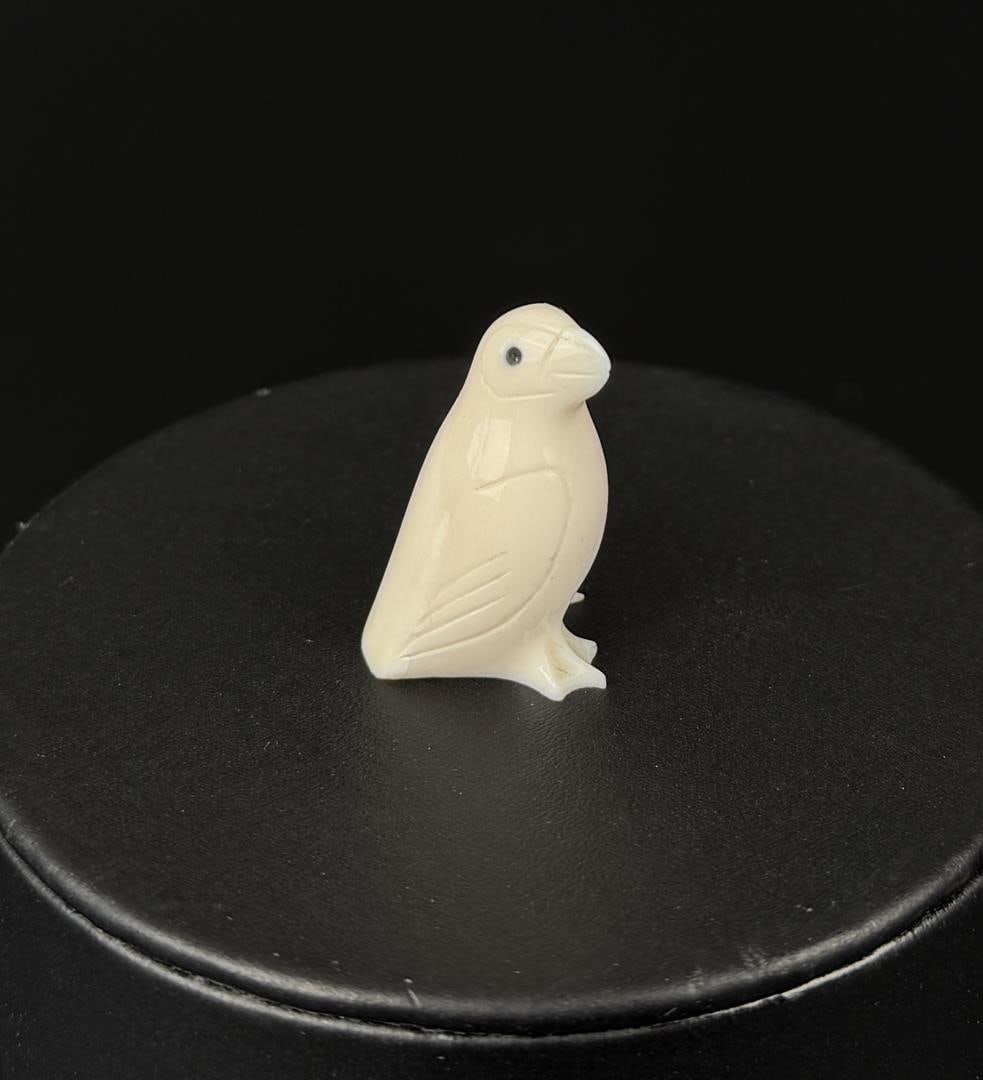 Alaskan Inuit Eskimo Carved Ivory Puffin: 1" by 5/8" by 1/2". Carved Walrus Ivory. Native made prior to 1972. This item cannot be shipped to Oregon, California, Hawaii, New York, New Jersey, Internationally, or any other state that prohibits.