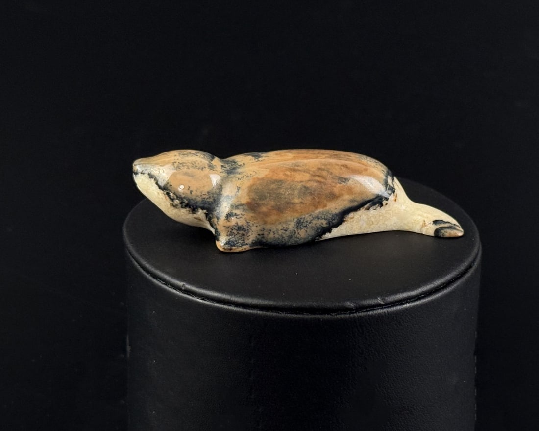 Russian Inuit Carved Mammoth Ivory Seal: 2 7/8" by 1" by 5/8". Native made prior to 1972. This item cannot be shipped to Oregon, California, Hawaii, New York, New Jersey, Internationally, or any other state that prohibits.
