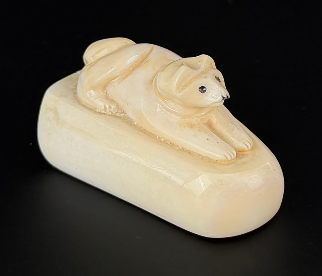 Alaskan Inuit Eskimo Carved Ivory Sled Dog: 2 1/8" by 1 1/4" by 1". Native made prior to 1972. This item cannot be shipped to Oregon, California, Hawaii, New York, New Jersey, Internationally, or any other state that prohibits.