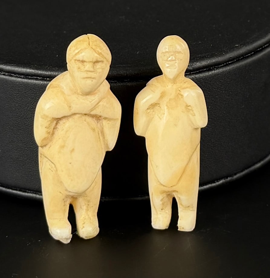 Madeleine Isserkut Kringayak Inuit Carved Family: Largest is 1 5/8" by 1/2" by 1/2". Native made prior to 1972. This item cannot be shipped to Oregon, California, Hawaii, New York, New Jersey, Internationally, or any other state that prohibits.