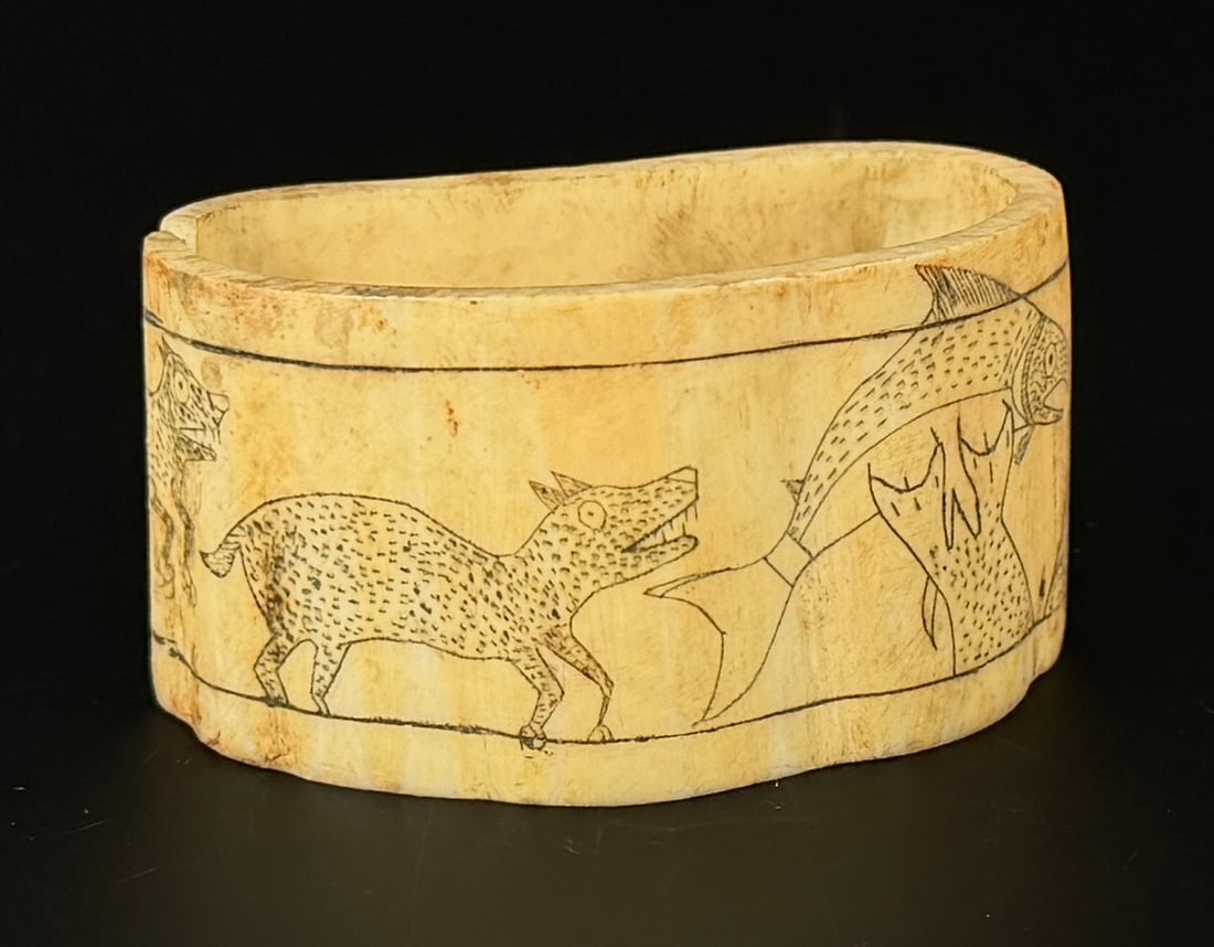 Alaskan Inuit Eskimo Ivory Napkin Ring: 2 1/2" by 1 3/8" by 1 1/4". Native made prior to 1972. This item cannot be shipped to Oregon, California, Hawaii, New York, New Jersey, Internationally, or any other state that prohibits.