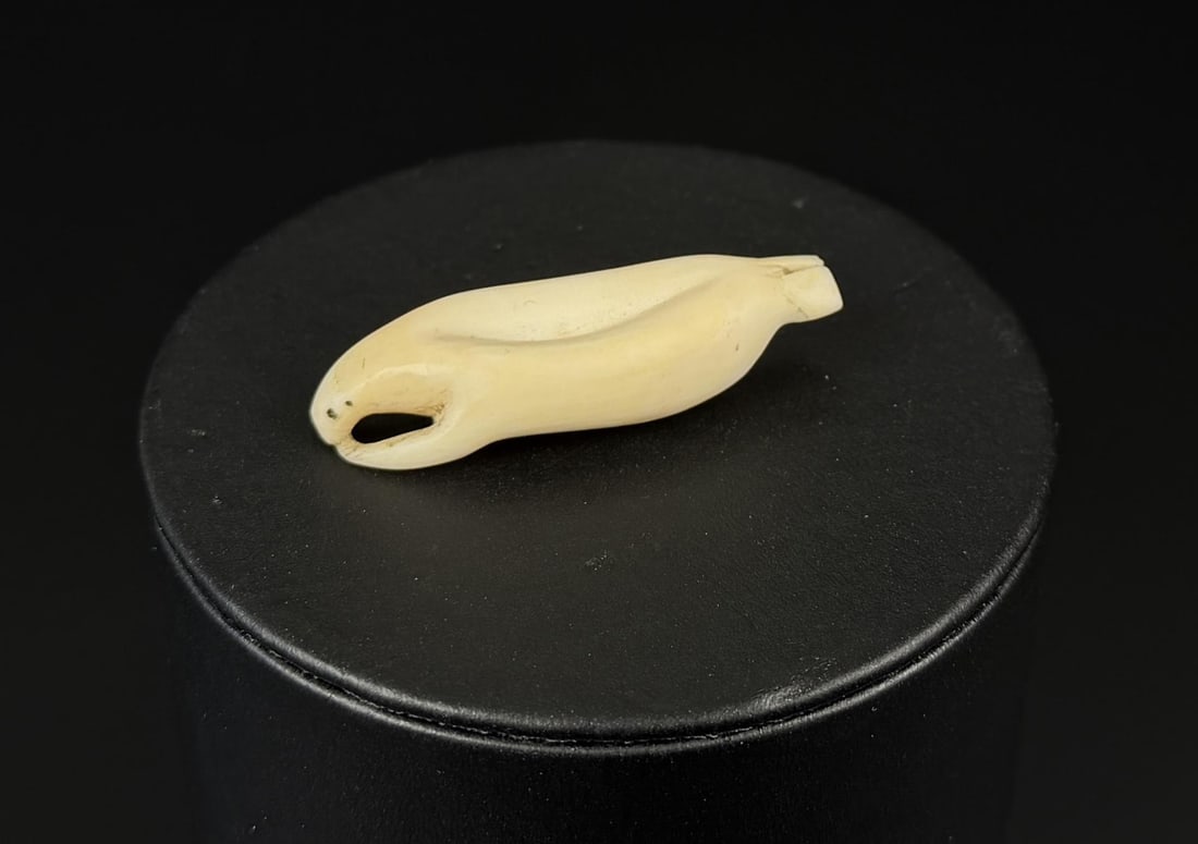 Antique Alaskan Inuit Eskimo Seal Button Toggle: Seal form. 1 3/4" long. Native made prior to 1972. This item cannot be shipped to Oregon, California, Hawaii, New York, New Jersey, Internationally, or any other state that prohibits.