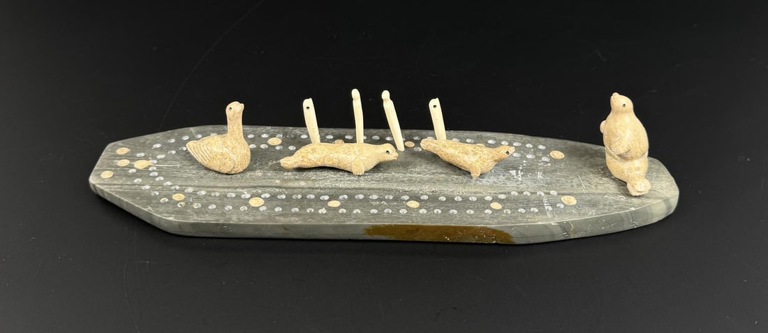 Alaskan Inuit Eskimo Walrus Ivory Cribbage Board: 11 1/2" by 3 1/8" by 1/2". Native made prior to 1972. This item cannot be shipped to Oregon, California, Hawaii, New York, New Jersey, Internationally, or any other state that prohibits.