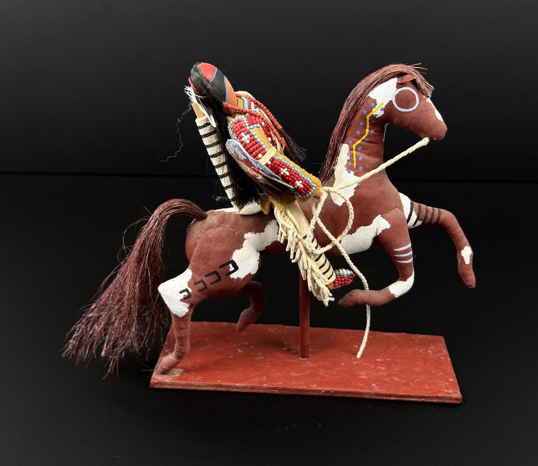 Marty Cuny Native American Indian Beaded Doll: 9 1/2" by 7 1/2" by 4". Making dolls and traditional styled craftwork over the past 45 years, artist Marty Cuny, an enrolled member of the Oglala Sioux Tribe, considers his work contemporary with