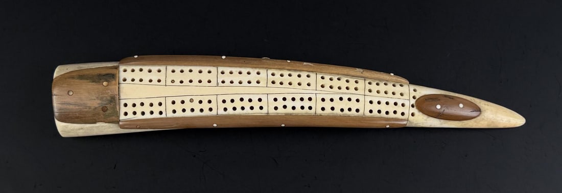 Alaskan Inuit Eskimo Walrus Ivory Cribbage Board: 10" long. Native made prior to 1972. This item cannot be shipped to Oregon, California, Hawaii, New York, New Jersey, Internationally, or any other state that prohibits.
