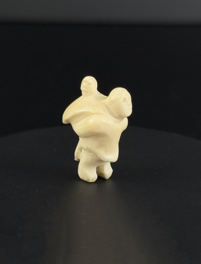 Madeleine Isserkut Kringayak Inuit Carved Mother: 1 1/8" tall. Native made prior to 1972. This item cannot be shipped to Oregon, California, Hawaii, New York, New Jersey, Internationally, or any other state that prohibits.
