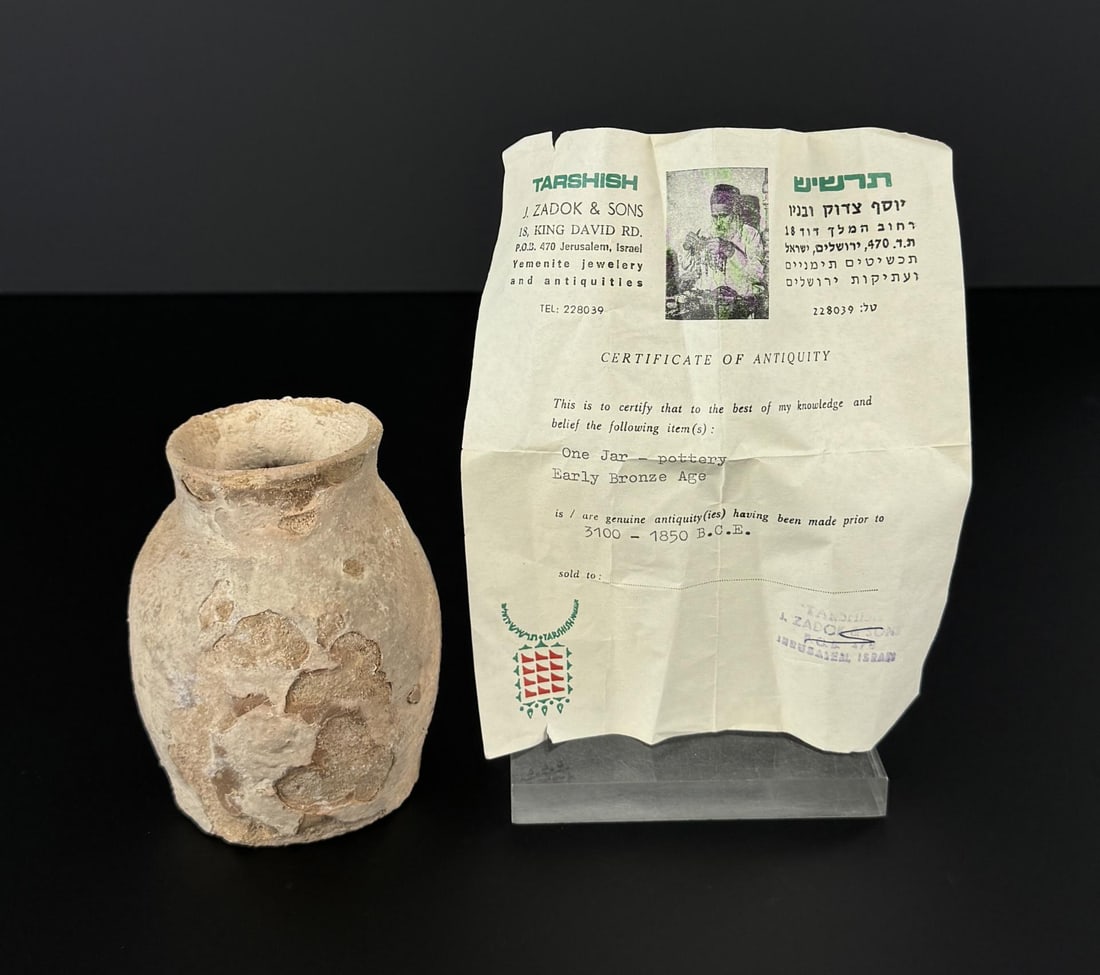 Ancient Holy Land Canaanite Terracotta Jar: J. Zadok & Sons COA. 4" tall, 3 3/8" diameter.