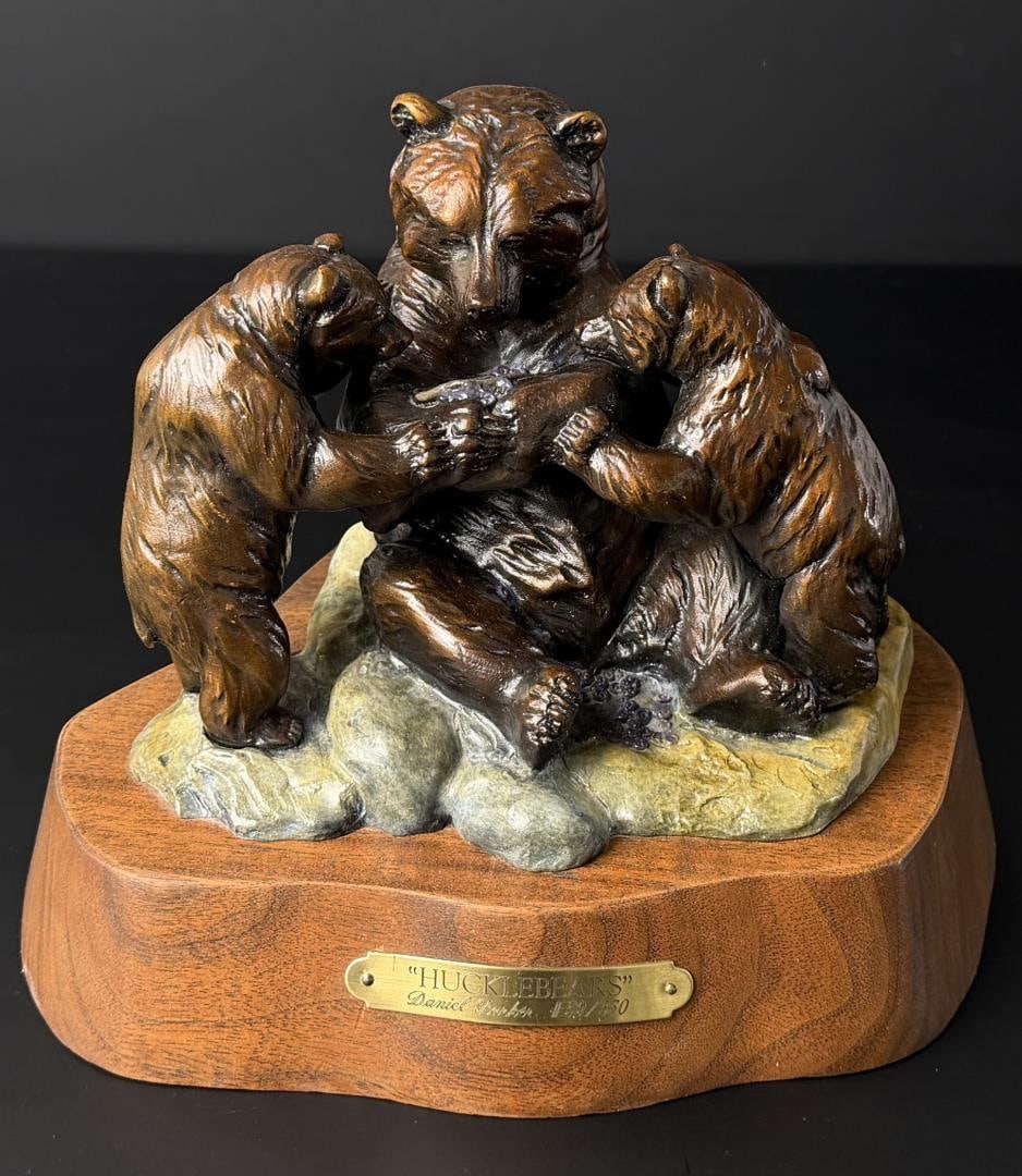 Daniel Parker Hucklebears Bronze: Title is Hucklebears. 9 1/4" by 7 7/8" by 7 1/4". 59/350. Daniel Ray Parker (Born 1959) is active/lives in Montana, Oregon. Daniel Parker is known for North American and African animal sculpture. DANI