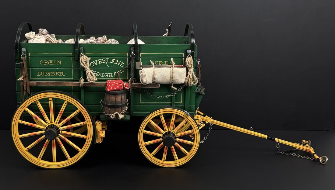 Dale Ford Overland Freight Wagon Model: Title is Overland Freight. 25 3/8" by 11 1/2" by 9 7/8" with pole extended outward. Carriage is 16 7/8" by 11 1/2" by 9 7/8". Dale Ford, of Redding, California, has been a full-time western artist