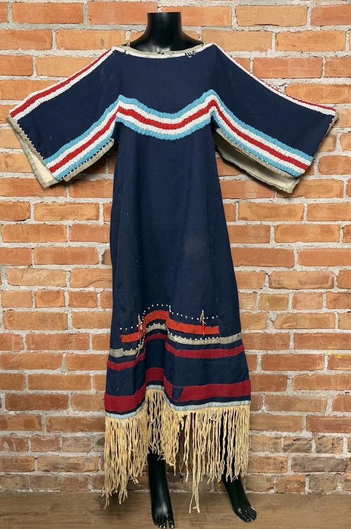 Flathead Native American Indian Beaded Dress: From the Flathead Nation of Montana. First Quarter of the 20th Century. 44" long with a bust of 18".