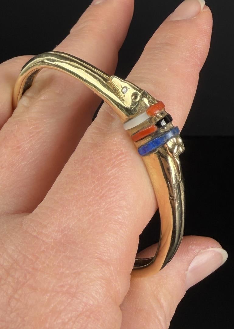 Mike White Buffalo Perez Comanche 14k Bracelet: Lapis Lazuli, Onyx, Coral, and Opal. 5 3/8" inner circumference. 26.4 grams. Lot requires payment via non credit card only.
