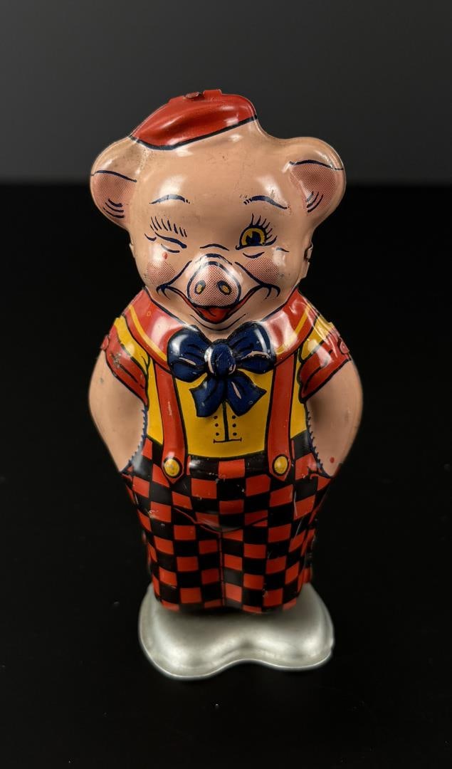 J Chein and Co 1930s Winking Wind Up Pig: 4 1/2" by 2" by 1 7/8". In working condition.