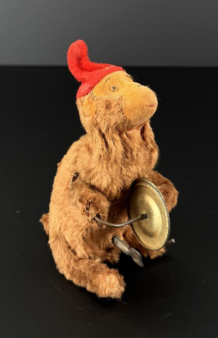 1950s APLS Japanese Wind Up Monkey Toy: 5 7/8" by 3 7/8" by 3". In working condition.
