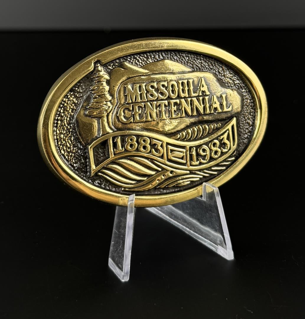 1983 Missoula Centennial Brass Belt Buckle: 3 1/4" by 2 1/4" by 1/2". 1350/4000.