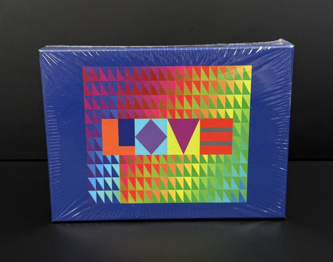 Jeffrey Gibson Love Wood Puzzle Sealed: From the Brooklyn Museum, 104 piece wood puzzle, 8" by 10". Jeffrey Gibson (born 1972) is a contemporary Indigenous American artist of Choctaw and Cherokee heritage known for vibrant mixed-media