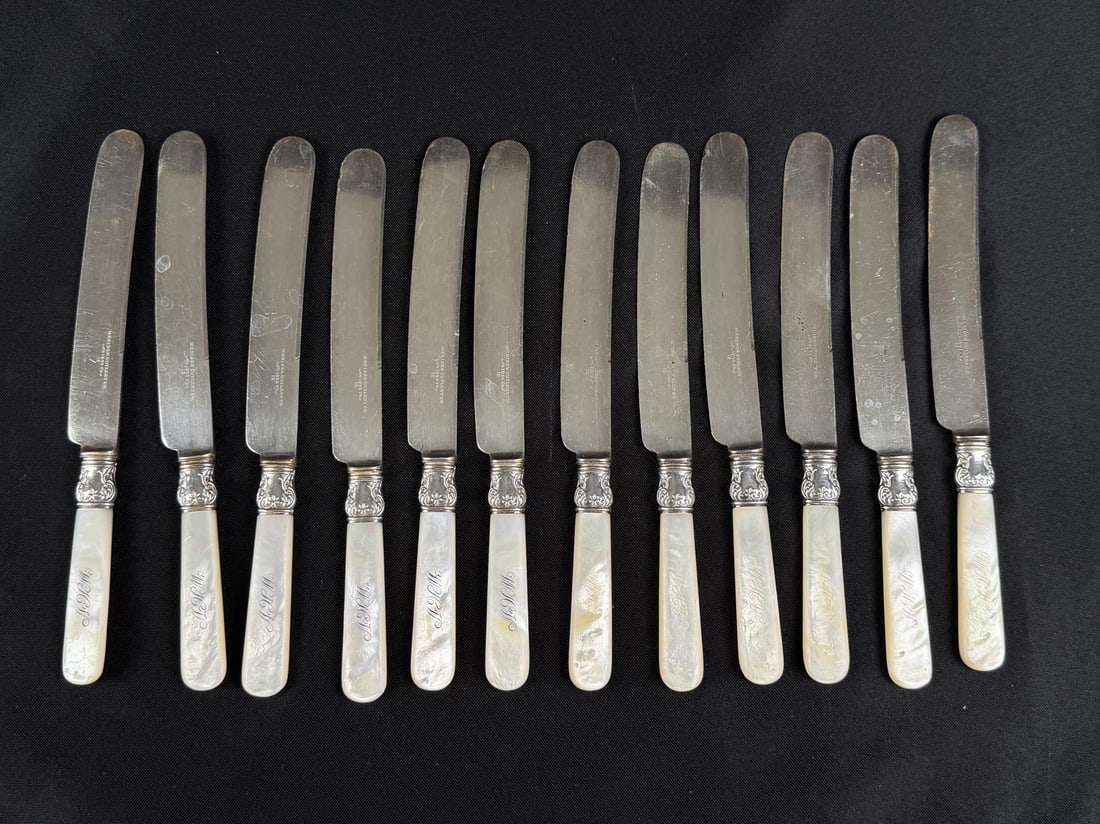 Victorian Sterling Collar Mother of Pearl Knives: Meriden Cutlery Company, 1855. Sterling Silver Collar, Mother of Pearl Handles with Monograms. Each knife is 8 3/4" long.